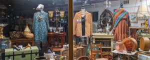 exterior of Monmouth Street Emporium showcasing antiques and clothing